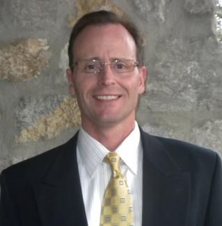 Ron Swatfigure insurance broker with Sun Mountain Insurance helping Colorado clients with unique policy needs